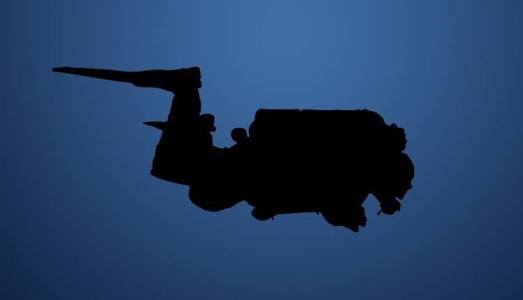 Silhouette of a solo diver with doubles in profile.