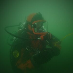 A public safety diver working in night or limited visibility conditions.